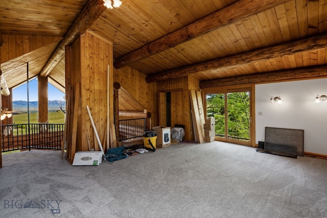 unfurnished living room featuring wood ceiling, carpet flooring, and vaulted ceiling with beams