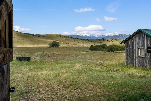 view of mountain feature with a rural view