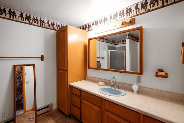 bathroom featuring a baseboard radiator, vanity, and tile patterned floors