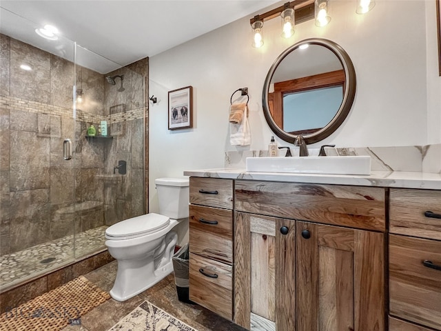 bathroom featuring vanity, toilet, tile patterned floors, and an enclosed shower