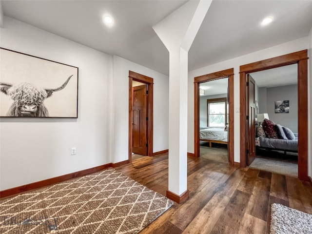 hallway featuring dark hardwood / wood-style floors