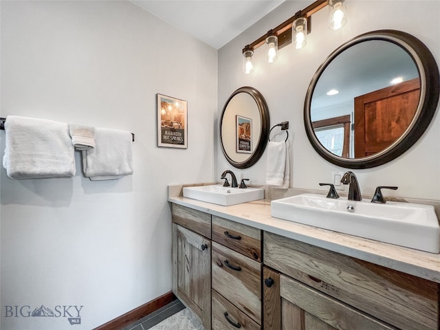 bathroom featuring dual bowl vanity