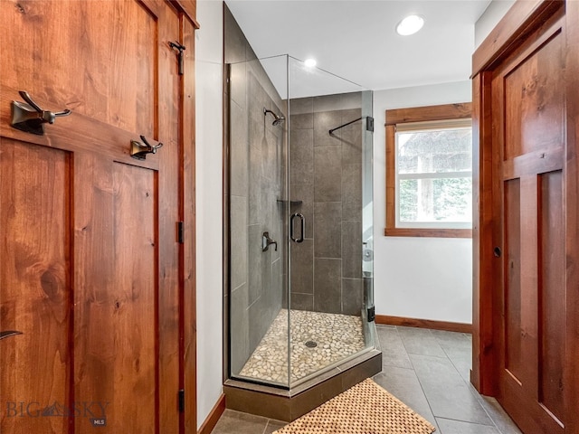 bathroom featuring tile patterned flooring and walk in shower