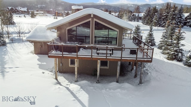 exterior space featuring a deck with mountain view