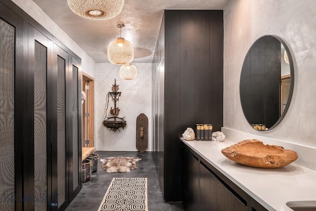 bathroom with concrete flooring and vanity