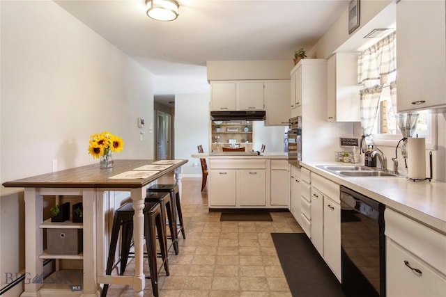 kitchen with black dishwasher, light countertops, white cabinetry, a sink, and under cabinet range hood