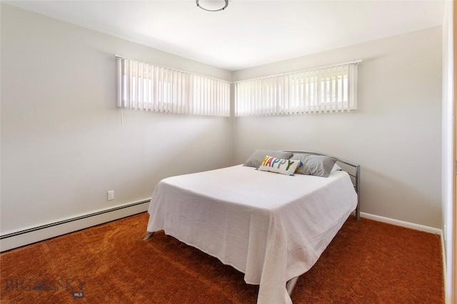 bedroom featuring a baseboard heating unit, baseboards, multiple windows, and dark carpet