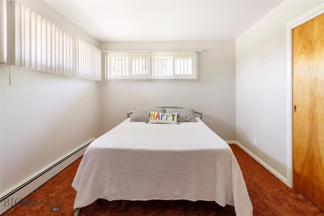 bedroom featuring dark carpet, a baseboard radiator, and baseboards