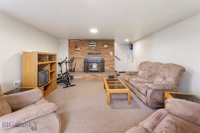 living room featuring a wood stove, carpet flooring, and recessed lighting