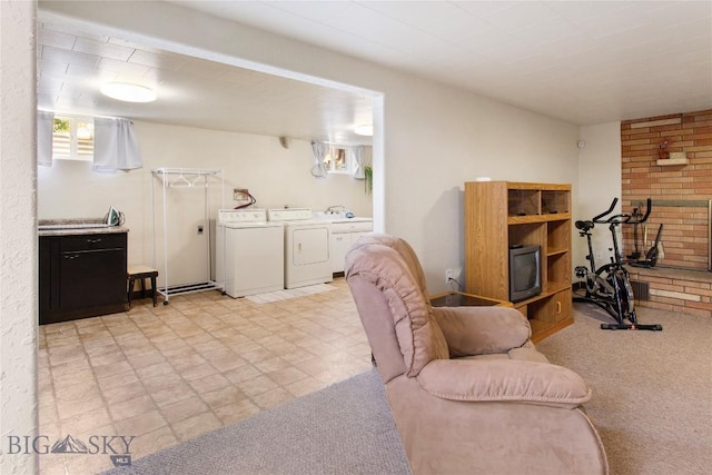 interior space with light carpet, washing machine and dryer, and a wood stove