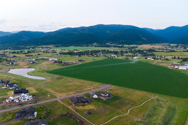 bird's eye view featuring a water and mountain view and a rural view