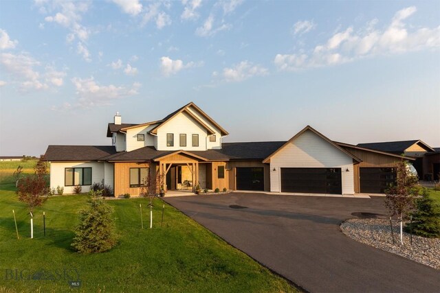 view of front of house with a garage and a front yard