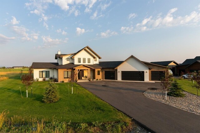 view of front facade featuring a garage and a front yard