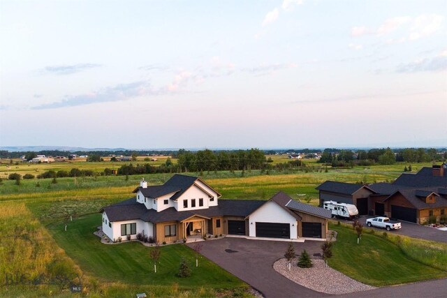 birds eye view of property with a rural view