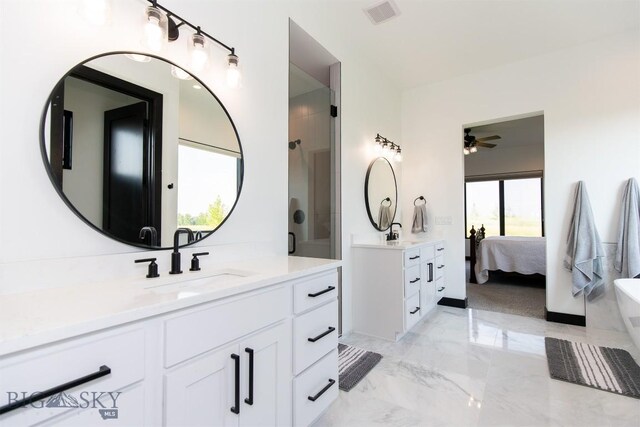 bathroom with dual bowl vanity, tile patterned flooring, walk in shower, and ceiling fan