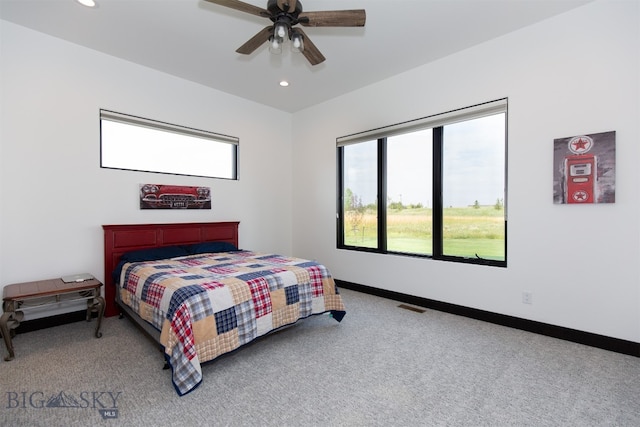 carpeted bedroom with ceiling fan