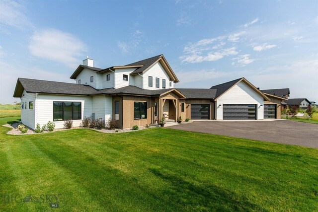 view of front facade with a garage and a front yard