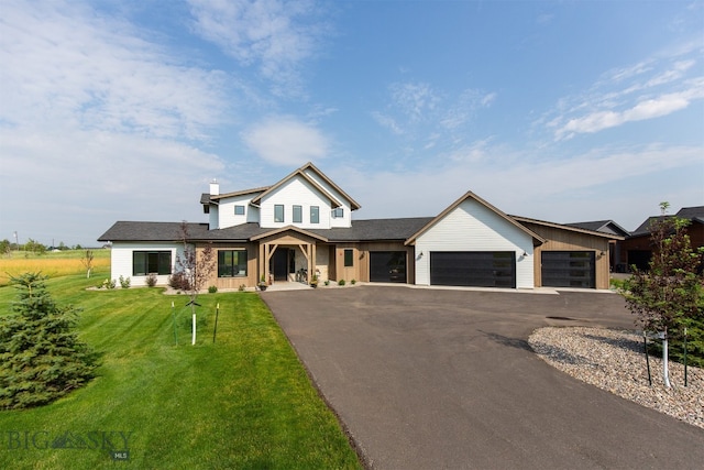 view of front of house featuring a garage and a front yard