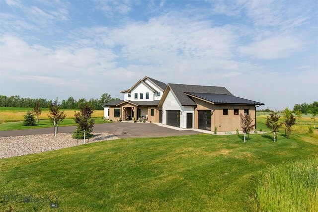 view of front of property featuring a rural view and a front yard