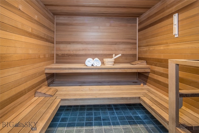 view of sauna / steam room with wooden walls and wood ceiling