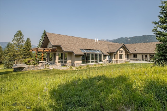 back of house featuring a mountain view