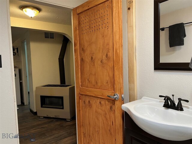 bathroom with vanity and hardwood / wood-style flooring