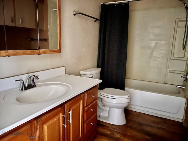 full bathroom with shower / tub combo with curtain, vanity, hardwood / wood-style flooring, and toilet