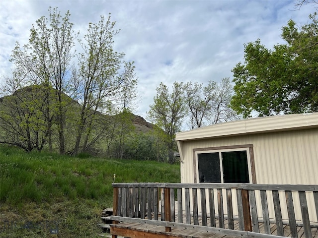 view of home's exterior featuring a deck