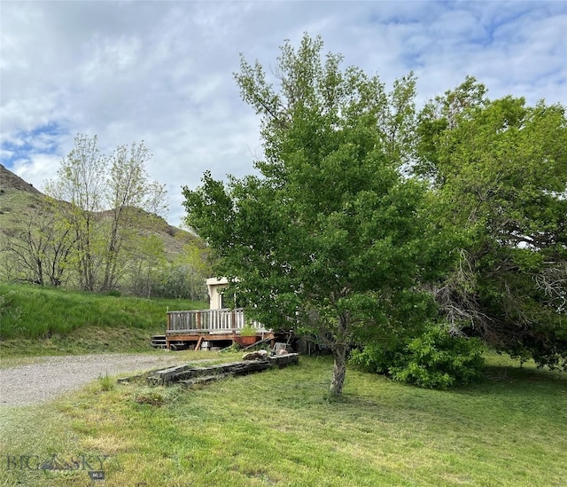 exterior space with a deck with mountain view