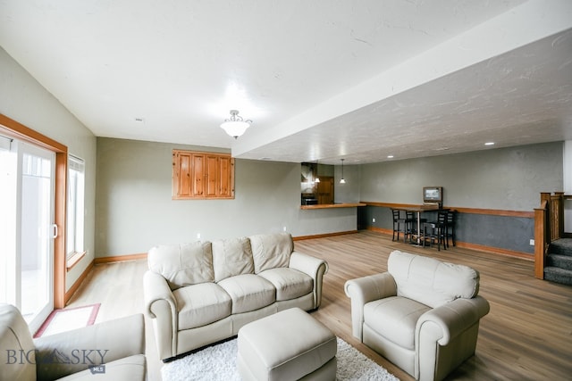 living room with light hardwood / wood-style flooring