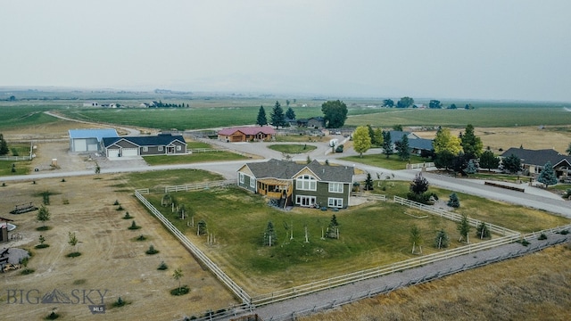 birds eye view of property featuring a rural view