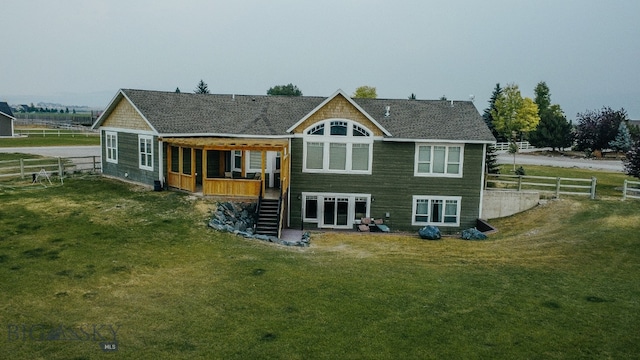 back of house featuring a yard