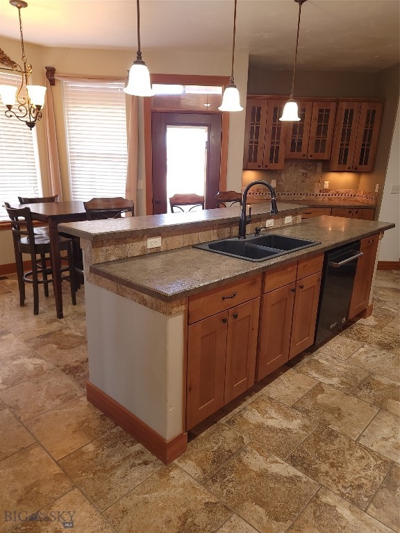 kitchen with pendant lighting, plenty of natural light, and sink