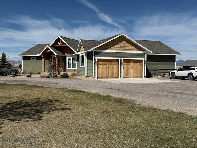 ranch-style house with an attached garage and driveway