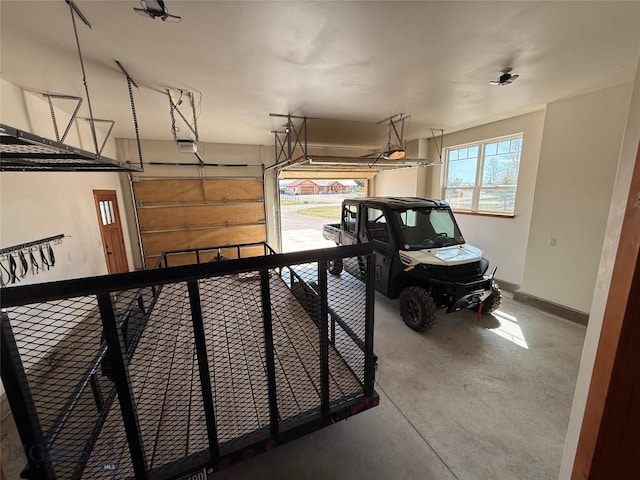 garage featuring baseboards and a garage door opener