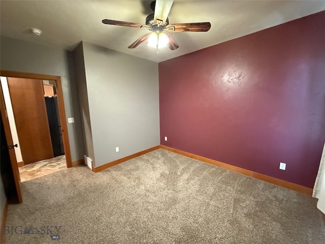 unfurnished bedroom featuring baseboards, a ceiling fan, and carpet flooring