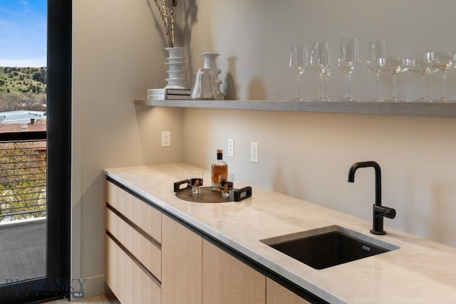 bar featuring a sink and bar