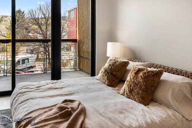 bedroom featuring a wall of windows