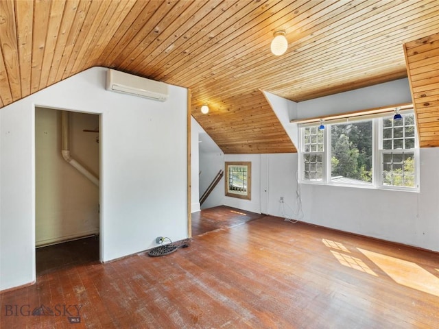 bonus room featuring vaulted ceiling, an AC wall unit, hardwood / wood-style floors, and wood ceiling