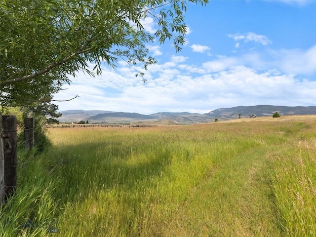 mountain view featuring a rural view