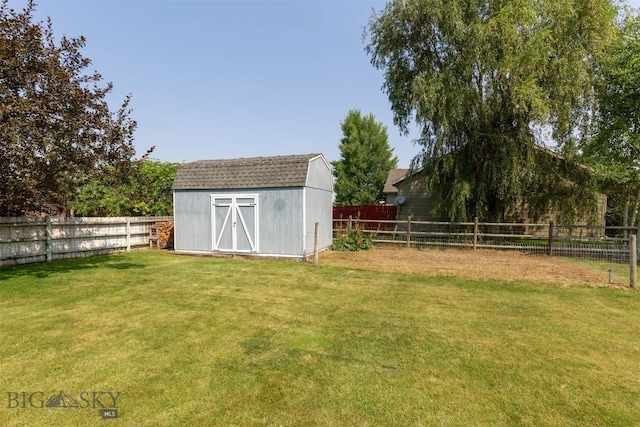 view of outbuilding with a lawn