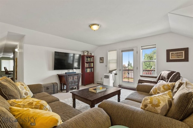 living room featuring light carpet and lofted ceiling