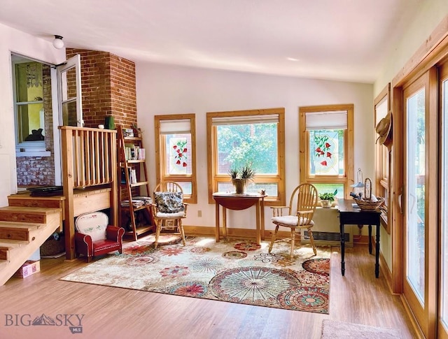 113 E Poppleton, Sheridan, MT 59749 - sitting room with vaulted ceiling, wood finished floors, and baseboards