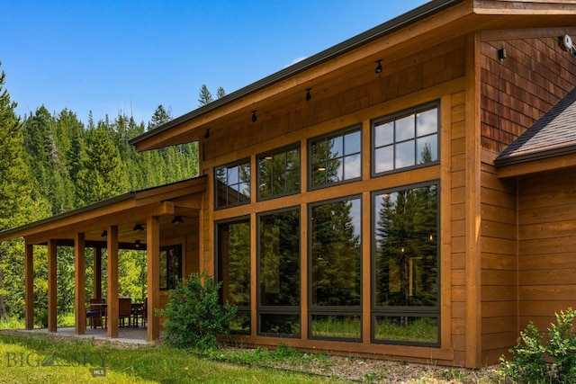 220 Watershed Rd, Big Sky, MT 59716 - exterior space featuring a patio and roof with shingles