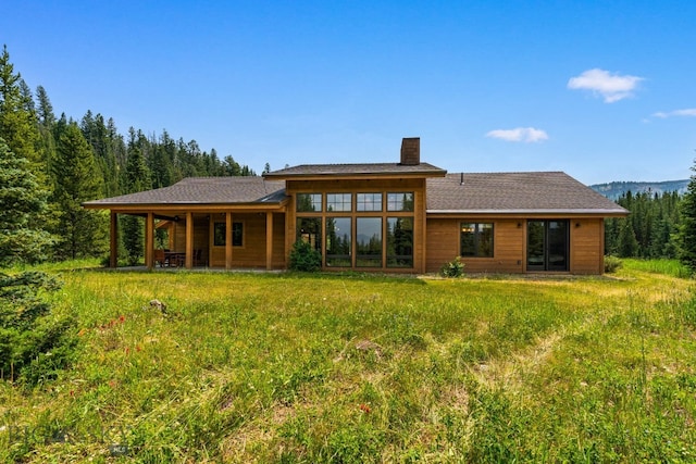 220 Watershed Rd, Big Sky, MT 59716 - rear view of house featuring a chimney