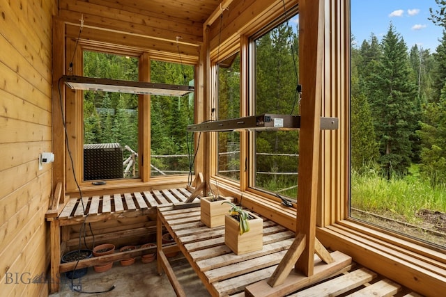 220 Watershed Rd, Big Sky, MT 59716 - unfurnished sunroom featuring a wooded view