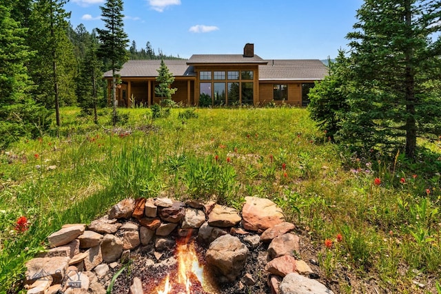 220 Watershed Rd, Big Sky, MT 59716 - rear view of property featuring a chimney