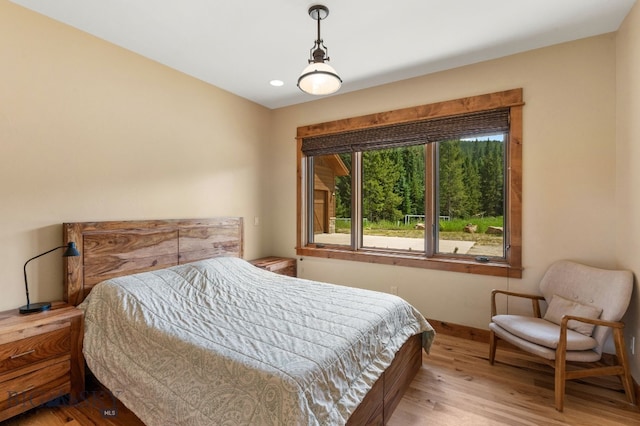 bedroom with light wood-type flooring