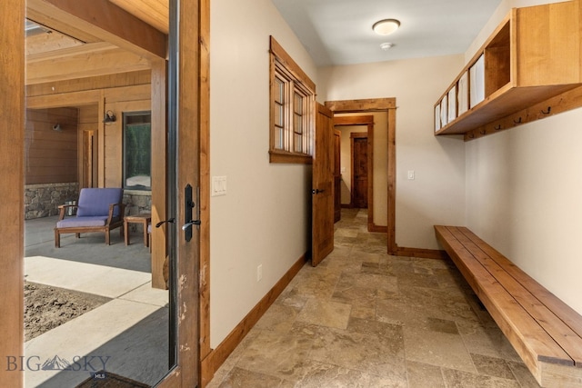220 Watershed Rd, Big Sky, MT 59716 - hall with baseboards, french doors, and stone finish floors