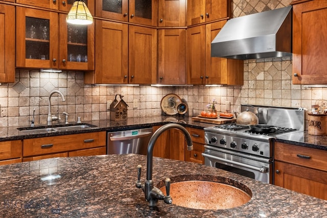 kitchen with backsplash, sink, wall chimney range hood, and stainless steel appliances